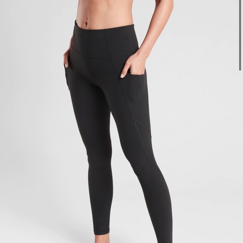 Brand new with tags Athleta Slash Pocket Salutation tights.
